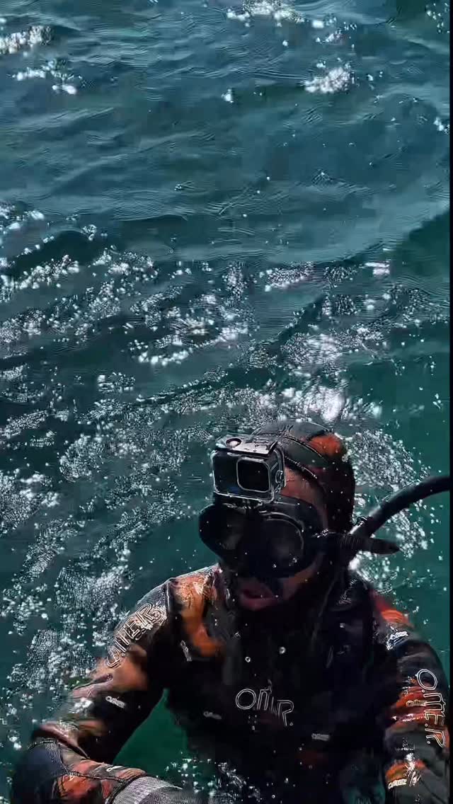 Spearfisher on the surface, Cape Monze
