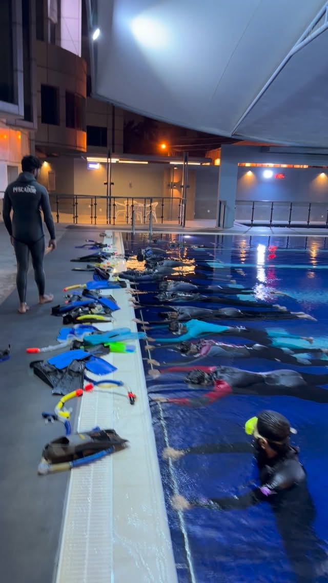 Students training together on the Karachi coast