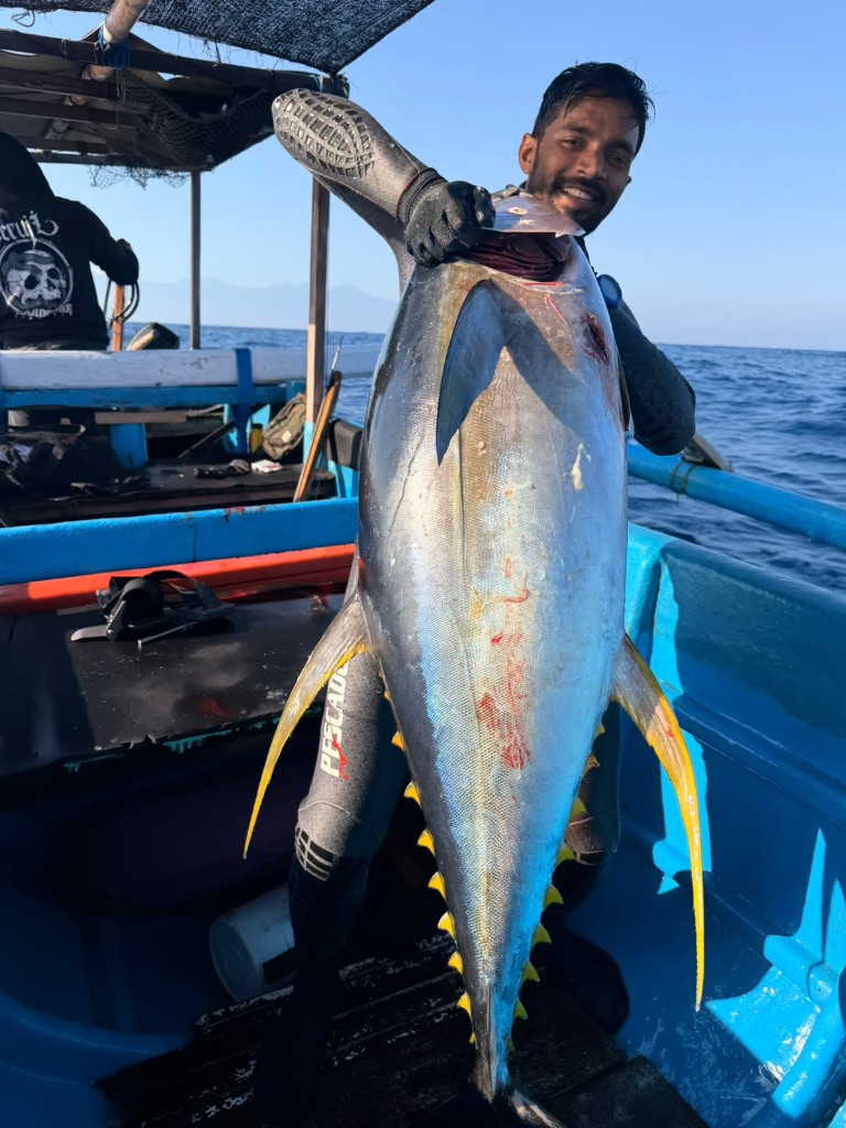 Waqar Khan with a yellowfin tuna on the boat