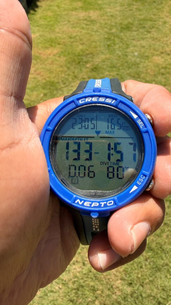 Dive computer showing maximum depth in feet